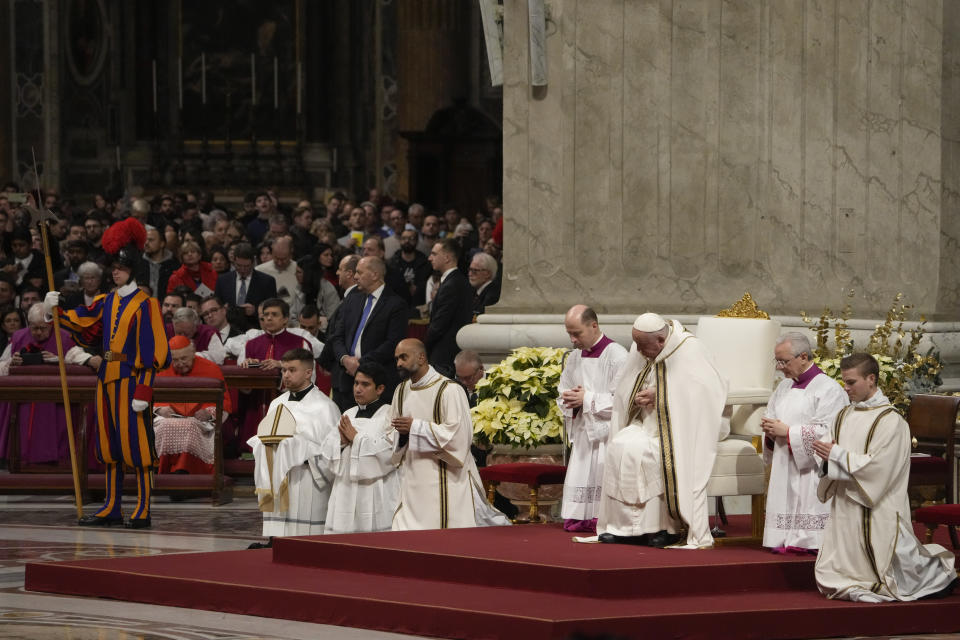 Pope Francis, third form right, presides over Christmas eve Mass, at St. Peter's Basilica at the Vatican, Sunday Dec. 24, 2023. (AP Photo/Gregorio Borgia)