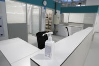 A bottle of santitiser sits on a desk in the empty Isabel Zendal new hospital during the official opening in Madrid, Spain, Tuesday, Dec. 1, 2020. Authorities in Madrid are holding a ceremony to open part of a 1,000-bed hospital for emergencies that critics say is no more than a vanity project, a building with beds not ready to receive patients and unnecessary now that contagion and hospitalizations are waning. Spain has officially logged 1.6 million infections and over 45,000 deaths confirmed for COVID-19 since the beginning of the year. (AP Photo/Paul White)