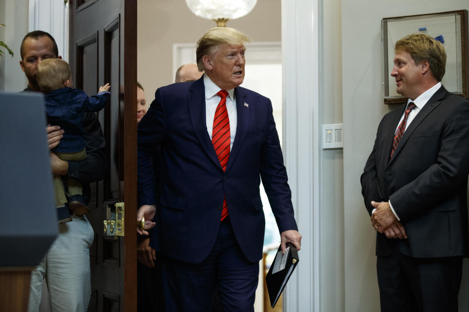 President Donald Trump arrives for an event on "transparency in Federal guidance and enforcement" in the Roosevelt Room of the White House, Wednesday, Oct. 9, 2019, in Washington. (AP Photo/Evan Vucci)