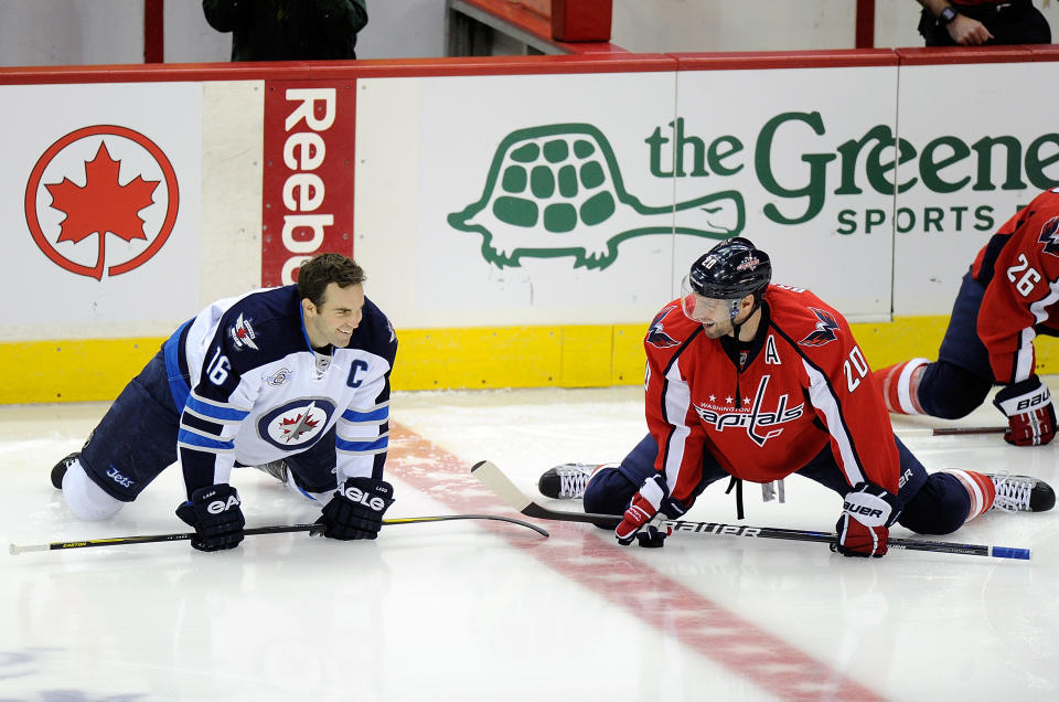 WASHINGTON, DC - FEBRUARY 09: Andrew Ladd #16 of the Winnipeg Jets talks with Troy Brouwer #20 of the Washington Capitals during warm ups at the Verizon Center on February 9, 2012 in Washington, DC. (Photo by Greg Fiume/Getty Images)