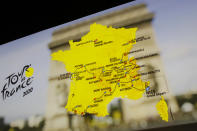 The roadmap of the Tour de France 2020 cycling race is projected on a screen during the event presentation, Tuesday, Oct.15, 2019 in Paris. Like a giant roller-coaster from start to finish over five mountain ranges, next year's Tour de France will feature new summits and only a few time-trial kilometers. (AP Photo/Thibault Camus)