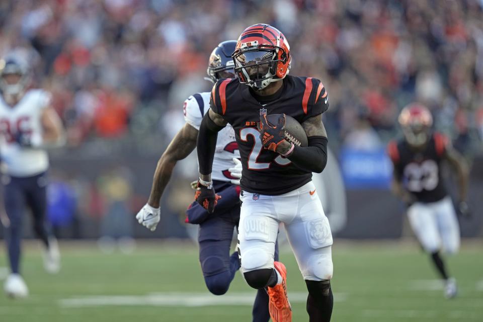 Cincinnati Bengals cornerback Cam Taylor-Britt (29) returns an interception against the Houston Texans during the second half of an NFL football game Sunday, Nov. 12, 2023, in Cincinnati. (AP Photo/Carolyn Kaster)