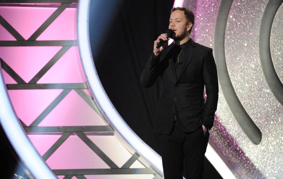 Dan Reynolds, of the musical group Imagine Dragons, speaks at the iHeartRadio Music Awards at the Shrine Auditorium on Thursday, May 1, 2014, in Los Angeles. (Photo by Chris Pizzello/Invision/AP)