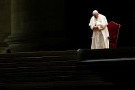 Pope Francis presides over the Via Crucis (Way of the Cross) ceremony outside of St. Peter's Basilica, at the Vatican