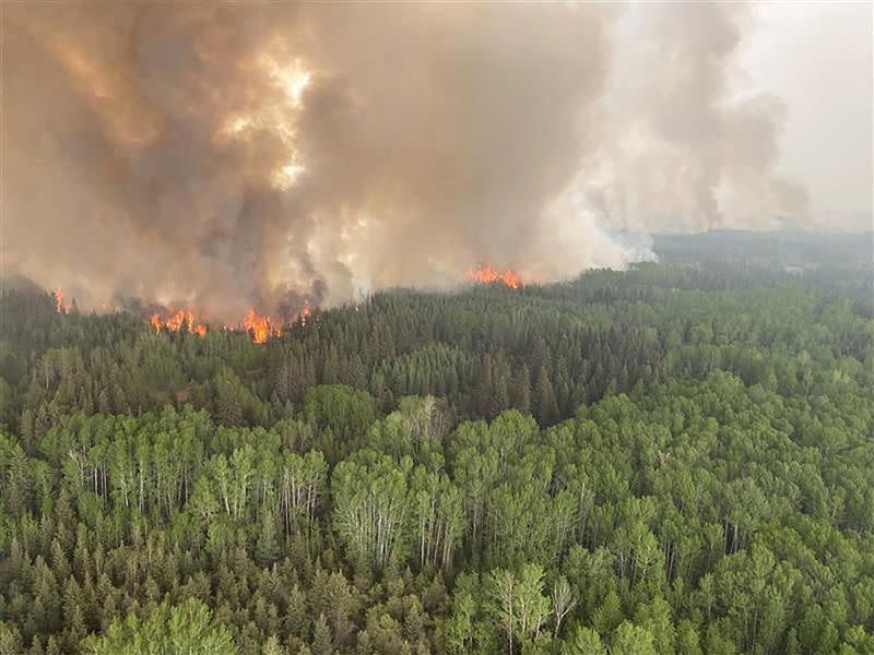 FILE PHOTO: Smoke rises from the Paskwa Wildfire (HLW030) as it burns near the Wood Buffalo National Park boundary