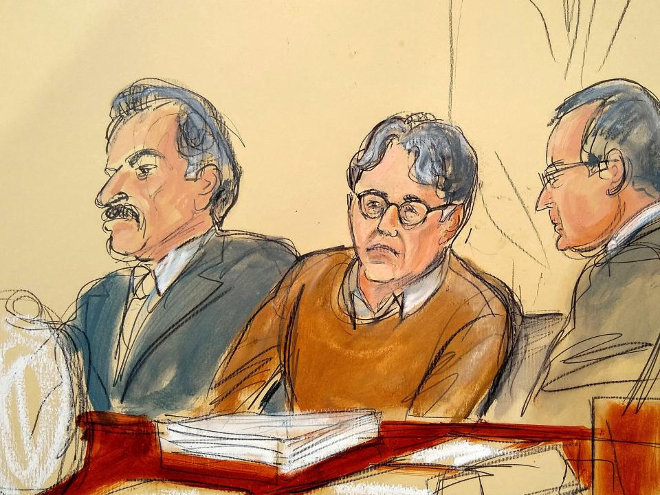 In this courtroom drawing, defendant Keith Raniere, center, is seated between his attorneys Paul DerOhannesian, left, and Marc Agnifilo during the first day of his sex trafficking trial, Tuesday, May 7, 2019. Raniere, the former leader of the self help group called NXIVM, has pleaded not guilty to the charges that he turned his followers into sex slaves. (Elizabeth Williams via AP)