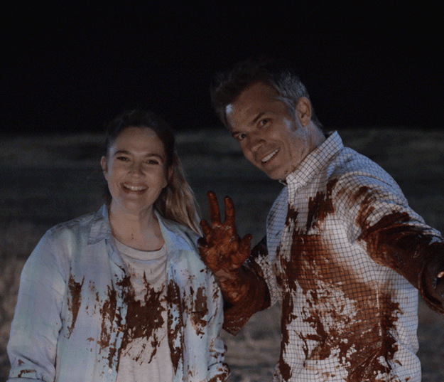 Joel and Sheila from "Santa Clarita Diet" smiling and covered in blood