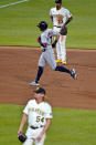 Cleveland Indians' Cesar Hernandez (7) runs the bases after hitting a grand slam off Pittsburgh Pirates relief pitcher Sam Howard (54) during the seventh inning of a baseball game in Pittsburgh, Friday, June 18, 2021. (AP Photo/Gene J. Puskar)