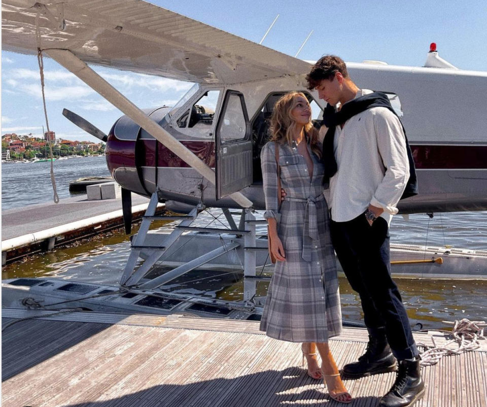 Bella Varelis with boyfriend Will Stokoe in front of a Sydney Seaplane