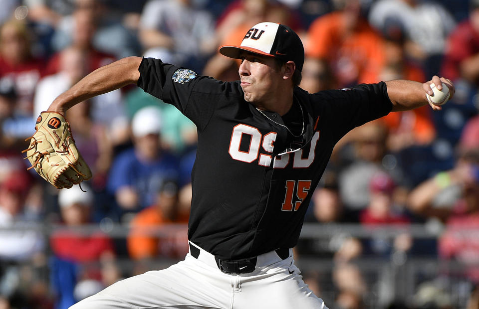 Oregon State pitcher Luke Heimlich throws against Arkansas during the first inning of Game 1 of the NCAA College World Series baseball finals in Omaha, Neb., Tuesday, June 26, 2018. (AP Photo/Ted Kirk)