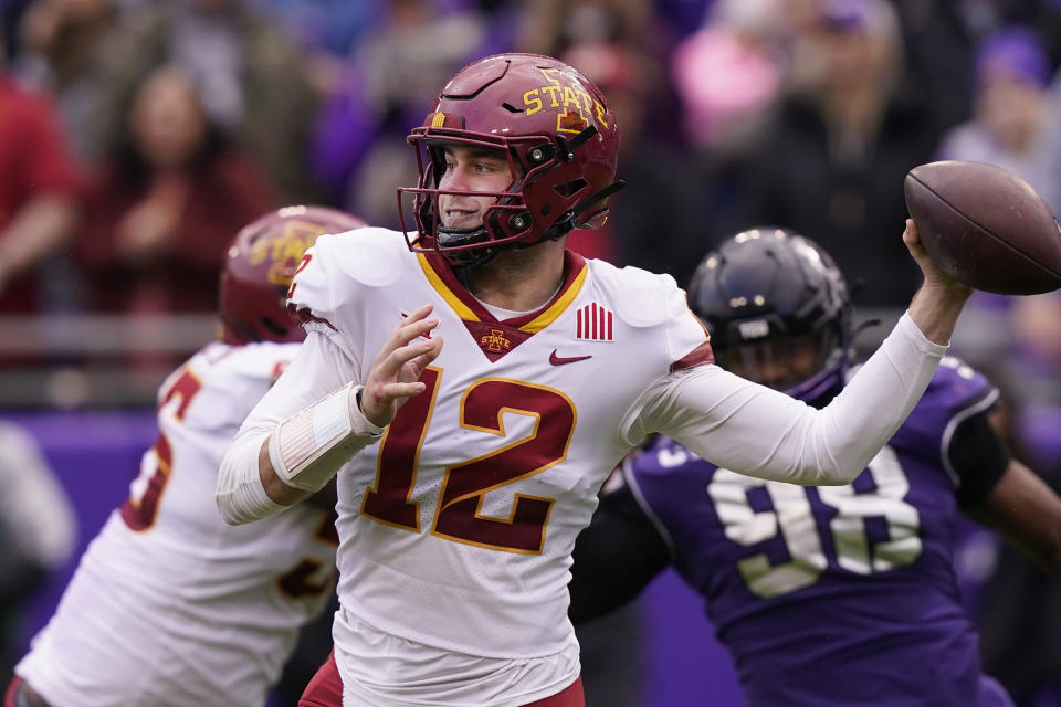 FILE - Iowa State quarterback Hunter Dekkers (12) passes as offensive lineman Darrell Simmons Jr. blocks TCU defensive lineman Dylan Horton (98) during the first quarter of an NCAA college football game in Fort Worth, Texas, Saturday, Nov. 26, 2022. Iowa State's primary focus in spring practice has been to improve an offense that struggled as the Cyclones made a fast descent to the bottom of the Big 12 last season. (AP Photo/LM Otero, File)