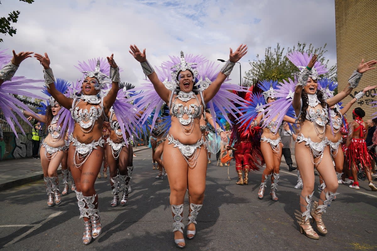 Performers taking part in the 2023 Notting Hill Carnival (PA Archive)