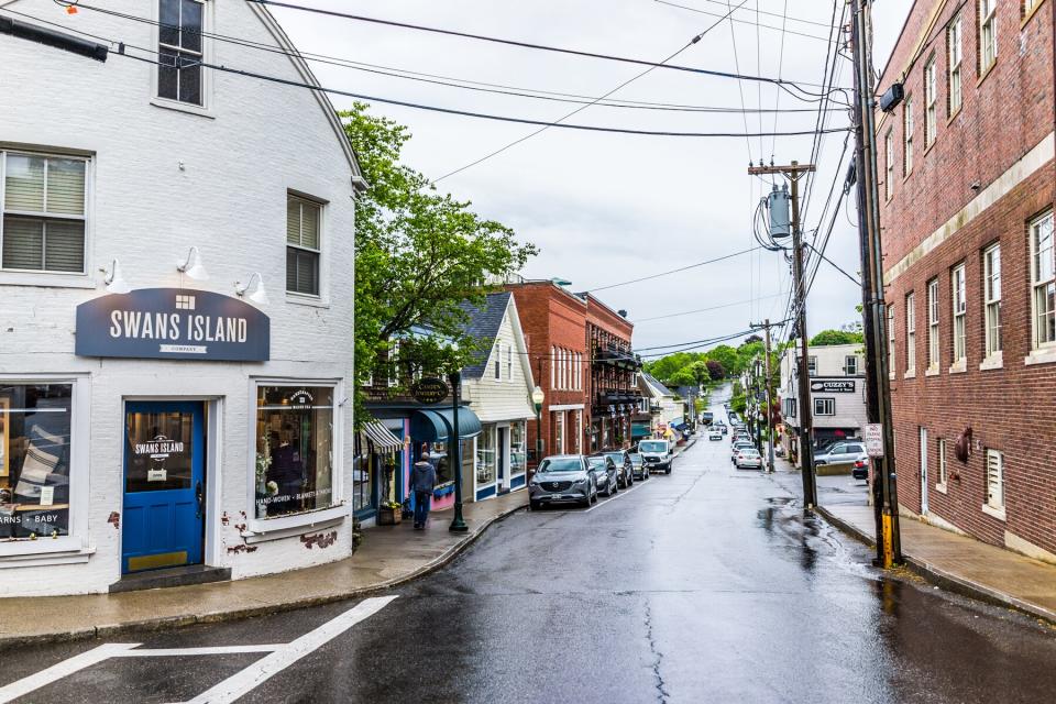 Downtown small village in Maine during rain with stores on empty street