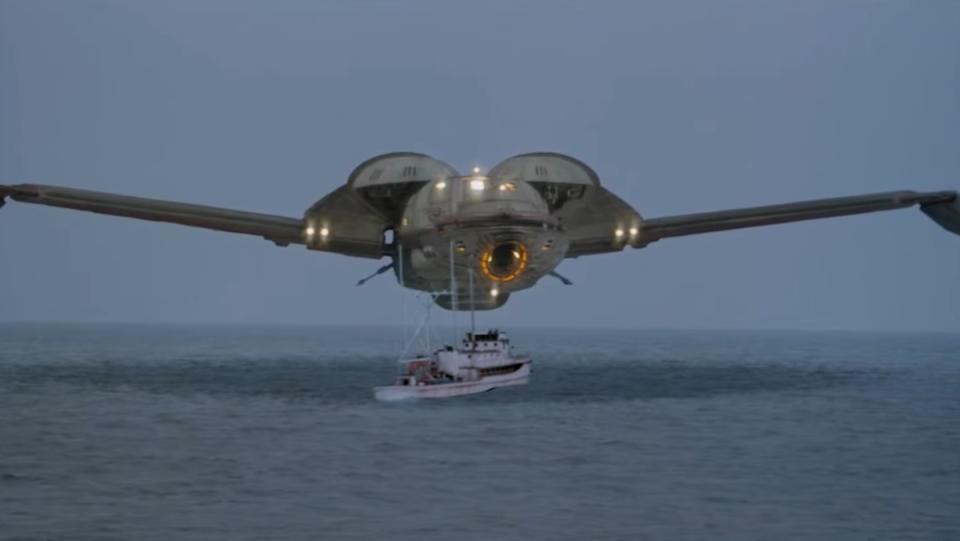 A Klingon Bird-of-Prey hovering above a fishing vessel in the sea in a scene from Star Trek IV. Could the Star Trek ship really have fit two whales?