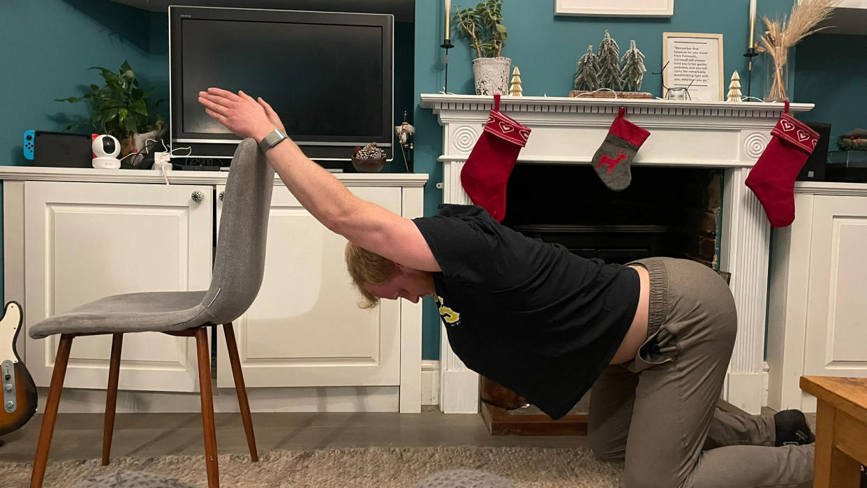  Fit&Well fitness writer Harry Bullmore performing a kneeling thoracic extension. 