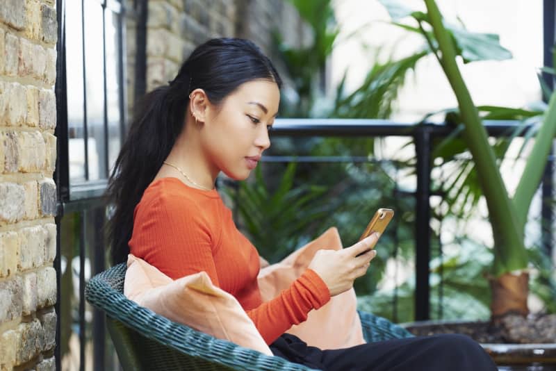 woman texting on mobile phone