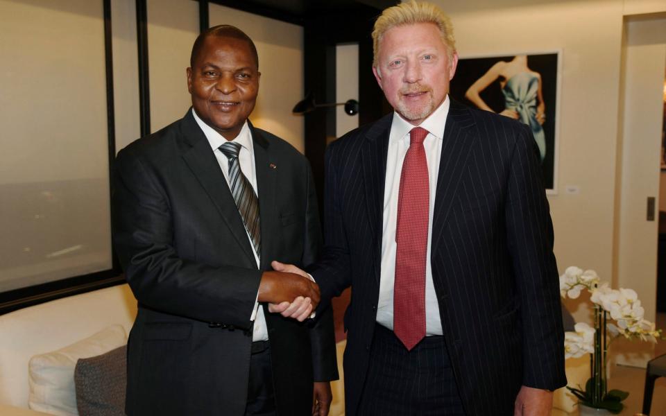 President Faustin Archange Touadera of the CAR with Boris Becker, in a picture released in April - Irle Moser Rechtsanw'lte PartG