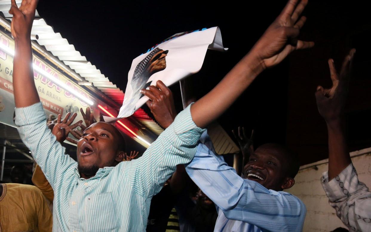 Supporters of Nigeria's President Muhammadu Buhari celebrate in Kano, Nigeria - REUTERS