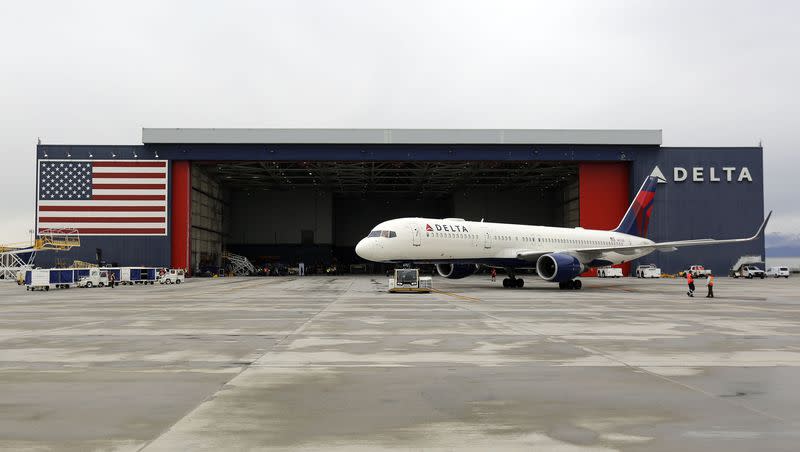 A Delta plane taxis to the Delta hangar at the Salt Lake City International Airport in Salt Lake City on Wednesday, April 15, 2020. Business Travel News recently named Delta as its top airline.