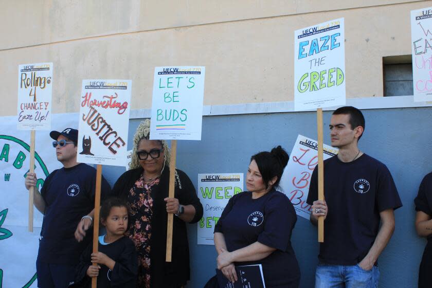 unionized workers gathered for a news conference at United Food and Commercial Workers Local 770 office