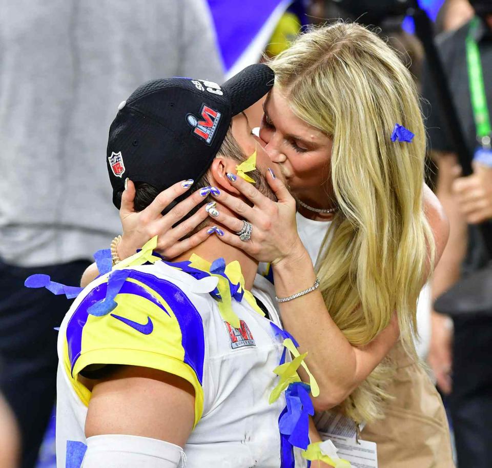 Matthew Stafford kisses wife Kelly Hall after winning Super Bowl LVI between the Los Angeles Rams and the Cincinnati Bengals at SoFi Stadium in Inglewood, California, on February 13, 2022