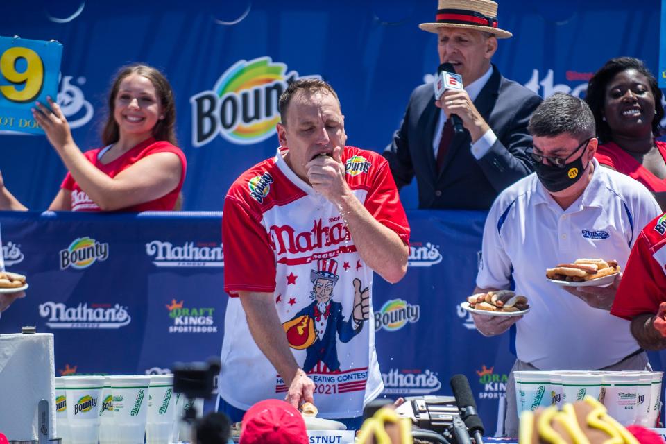 Joey Chestnut competes in the 2021 Nathan's Famous Fourth of July International Hot Dog-Eating Contest in Coney Island's Maimonides Park.