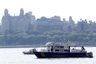 <p>NYPD search and rescue boats sit on the Hudson River near the site of small plane crash, Saturday, May 28, 2016, in North Bergen, N.J. A World War II vintage P-47 Thunderbolt aircraft crashed into the river Friday, May 27, 2016, killing its pilot. (AP Photo/Julio Cortez) </p>