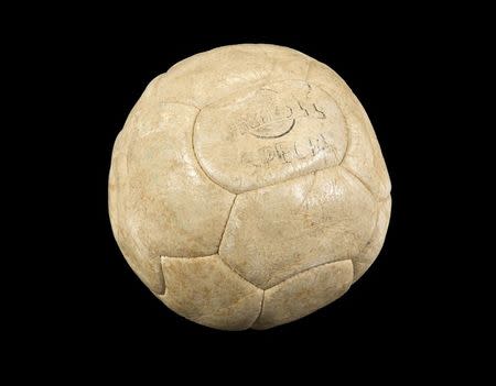 A white leather Drible brand football used by Pele to score his 1,000th career goal in a match that pitted his Santos FC team against rival Club de Regatas Vasco da Gama, known as Vasco da Gama, at Maracana Stadium in Rio de Janeiro, Brazil on November 19, 1969, is shown in this handout photo released on March 8, 2016. REUTERS/Julien's Auctions/Handout via Reuters