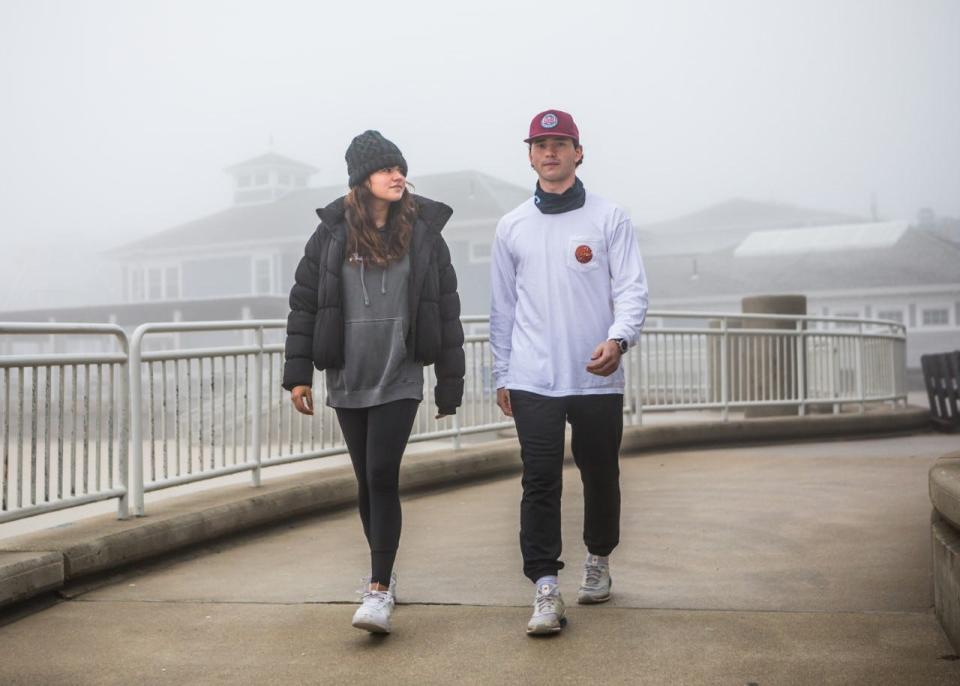 Winnacunnet High School graduate Emmie Daswani, left, and Exeter High School graduate Garret Roberts are seen at Hampton Beach where they will ended a 108-mile journey from Mt. Washington. They are raising money to support mental health.
