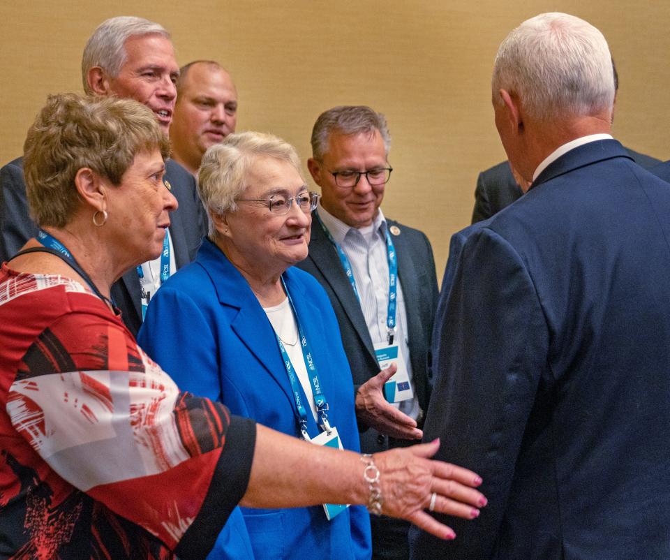 Former Vice President Mike Pence talks with the Indiana delegation after he spoke during the NCSL Legislative Summit at the Indiana Convention Center, Wednesday, Aug. 16, 2023 in Indianapolis.