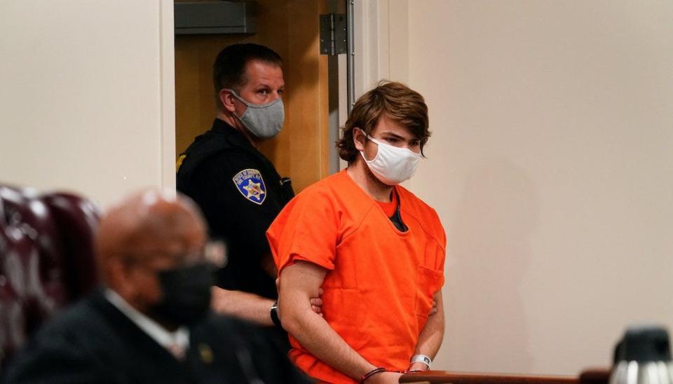 Payton Gendron, who cited his belief in white replacement theory prior to being arrested on charges related to a May 14 racial mass shooting in Buffalo, New York, is led into a courtroom for a hearing. (AP Photo)
