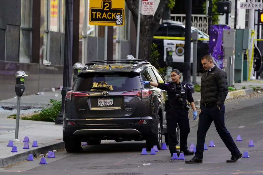 Investigators search for evidence in the area of a mass shooting In Sacramento, Calif. April 3, 2022. (AP Photo/Rich Pedroncelli)