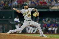 Oakland Athletics starting pitcher Adam Oller throws to the Texas Rangers in the first inning of a baseball game, Wednesday, Aug. 17, 2022, in Arlington, Texas. (AP Photo/Tony Gutierrez)