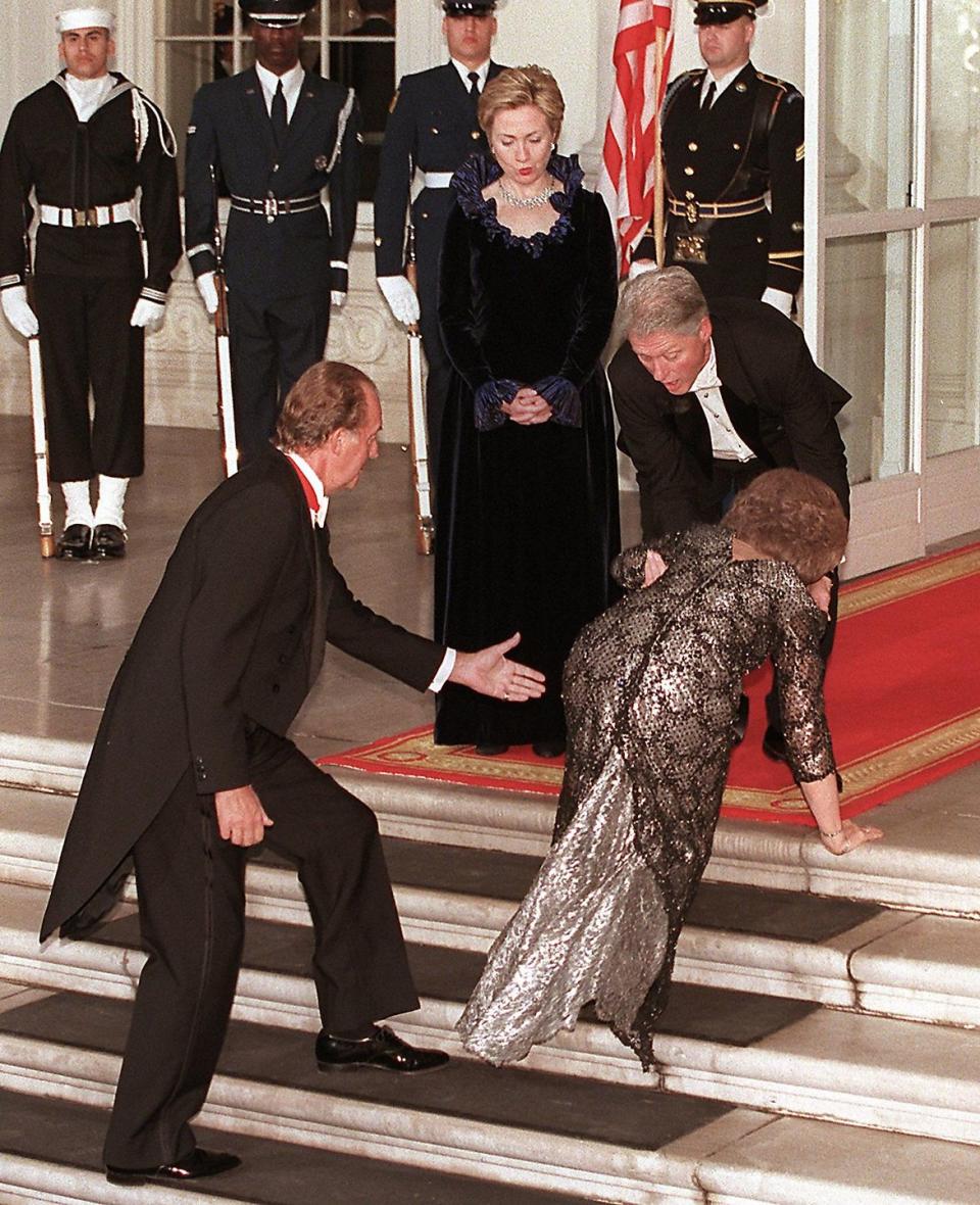 <p>Queen Sofia of Spain trips up the stairs of the White House upon arriving for a state dinner. President Bill Clinton reaches to help as First Lady Hillary Clinton looks on. Pesky steps. </p>