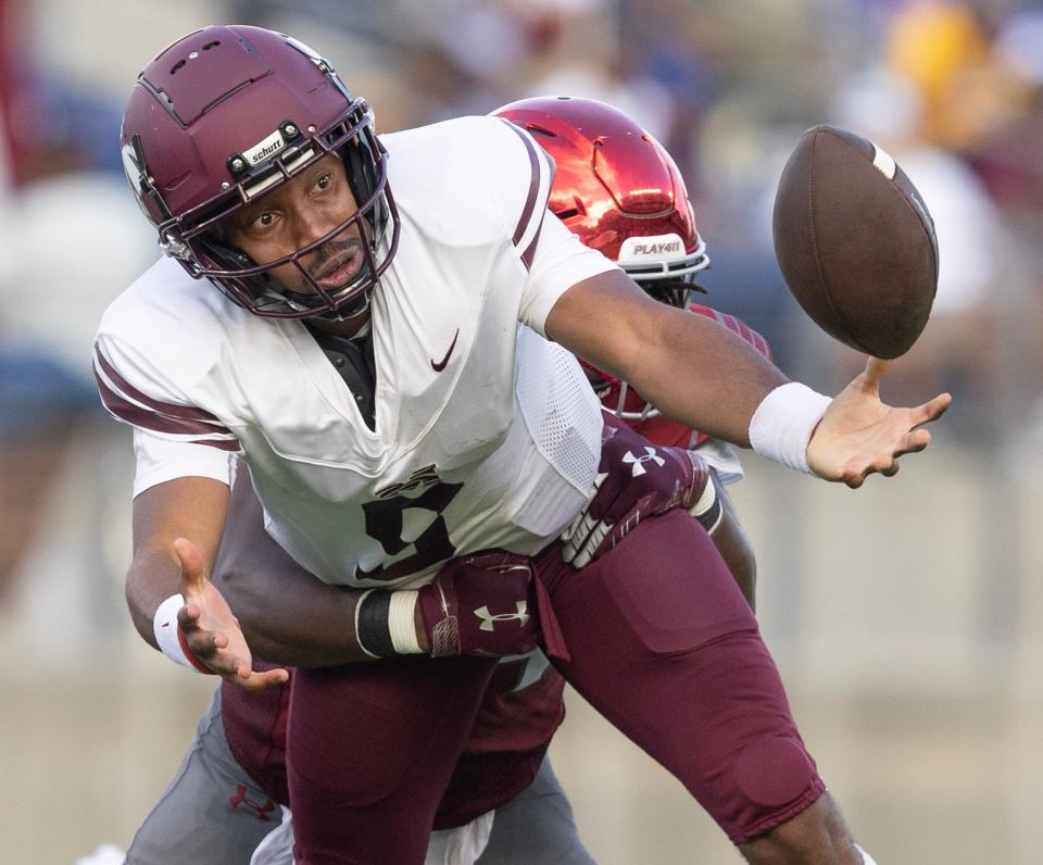 Virginia Union's Jabril Norman forces a fumble by Morehouse quarterback Derrach West in the second half of Sunday's Black College Football Hall of Fame Classic.