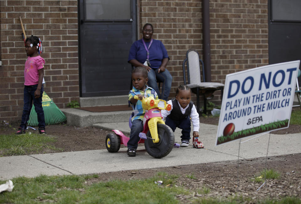 Residents of East Chicago, Indiana, like Nayesa Walker (center top) and her children were asked to leave their homes as testing has revealed high levels of lead and arsenic in their soil.