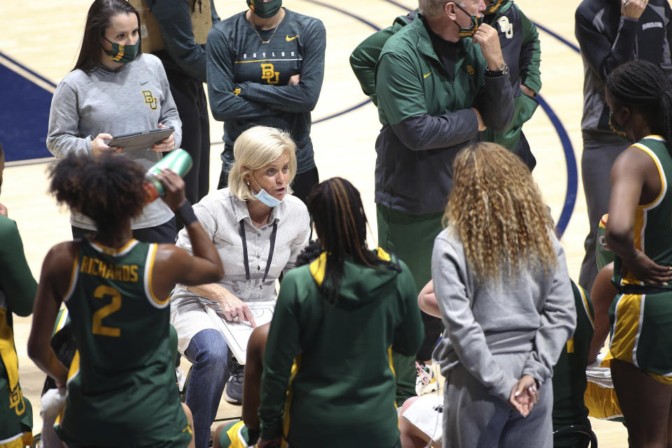 Baylor coach Kim Mulkey speaks to players during the second half of the team's NCAA college basketball game against West Virginia on Thursday, Dec. 10, 2020, in Morgantown, W.Va. (AP Photo/Kathleen Batten)