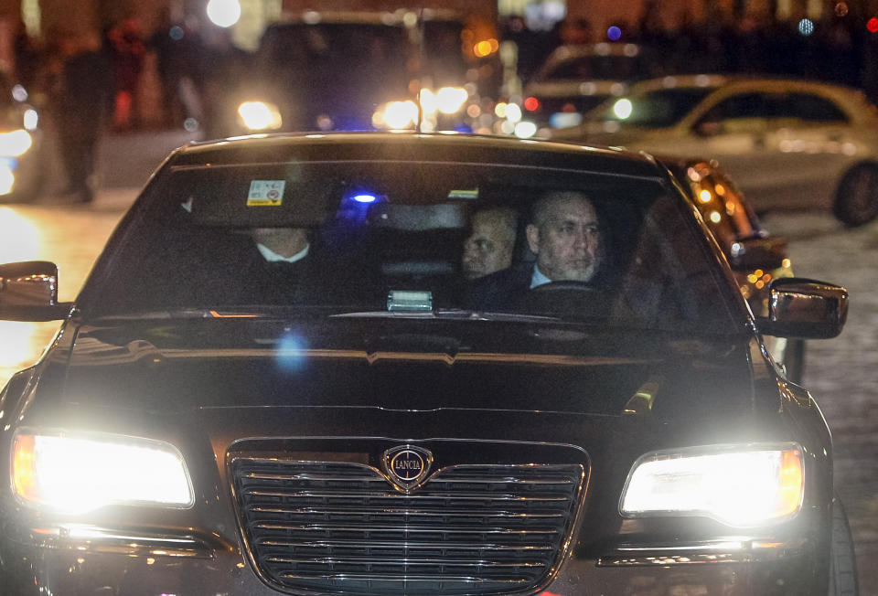 A car carrying Libyan eastern-based forces General Khalifa Hifter, center, leaves Italian Premier Giuseppe Conte's office in Rome, Wednesday, Jan. 8, 2020. Hifter traveled to Rome on Wednesday on a previously unannounced visit to meet with Italian Premier Giuseppe Conte. An Italian government spokesman, Rocco Casalino, said Serraj was expected to meet with Conte later in the evening. (Fabio Cimaglia/LaPresse via AP)