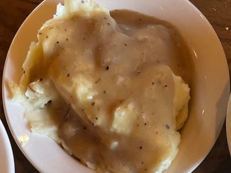Mashed potatoes and gravy in a bowl