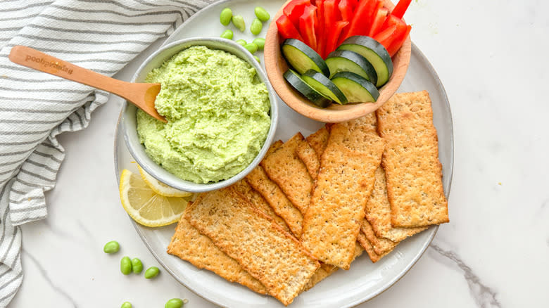 hummus with veggies and crackers