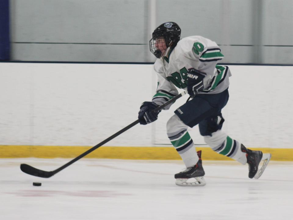 Dighton-Rehoboth/Seekonk's Adam Bastis brings the puck down ice during an MIAA-RIIL crossover game against South Kingstown/Westerly.