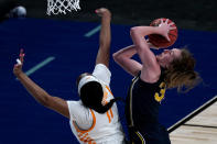 Michigan center Izabel Varejao, left, gets past Tennessee center Kasiyahna Kushkituah (11) to put up a shot during the first half of a college basketball game in the second round of the women's NCAA tournament at the Alamodome in San Antonio, Tuesday, March 23, 2021. (AP Photo/Charlie Riedel)