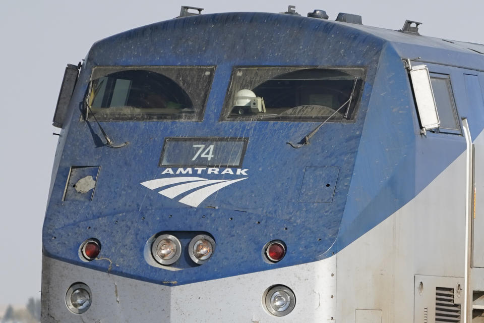 The front windows of an Amtrak train engine are shown, Monday, Sept. 27, 2021, near Joplin, Mont. The engine was part of a train that derailed Saturday, killing three people and injuring others. Federal investigators are seeking the cause of the derailment. (AP Photo/Ted S. Warren)