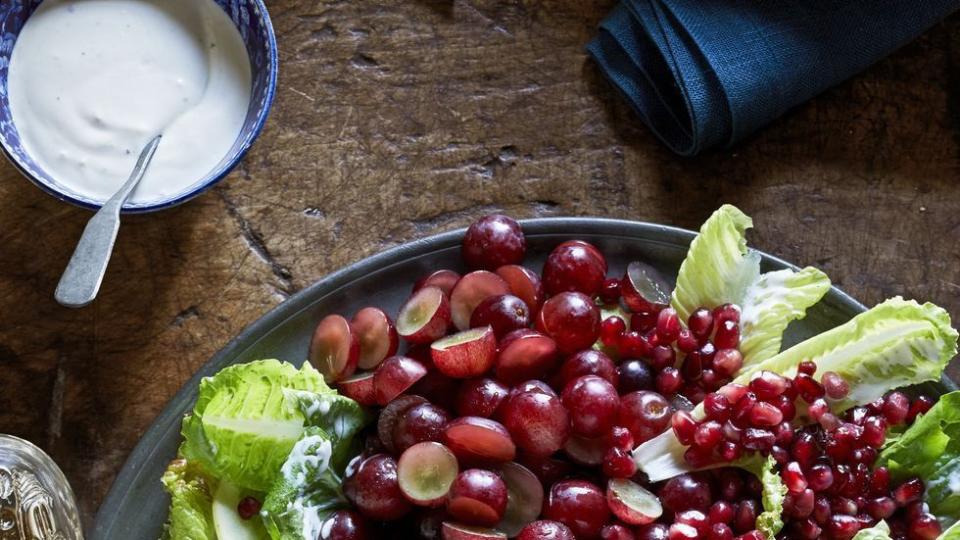 waldorf salad on a platter with all ingredients arranged separately and dressing on the side