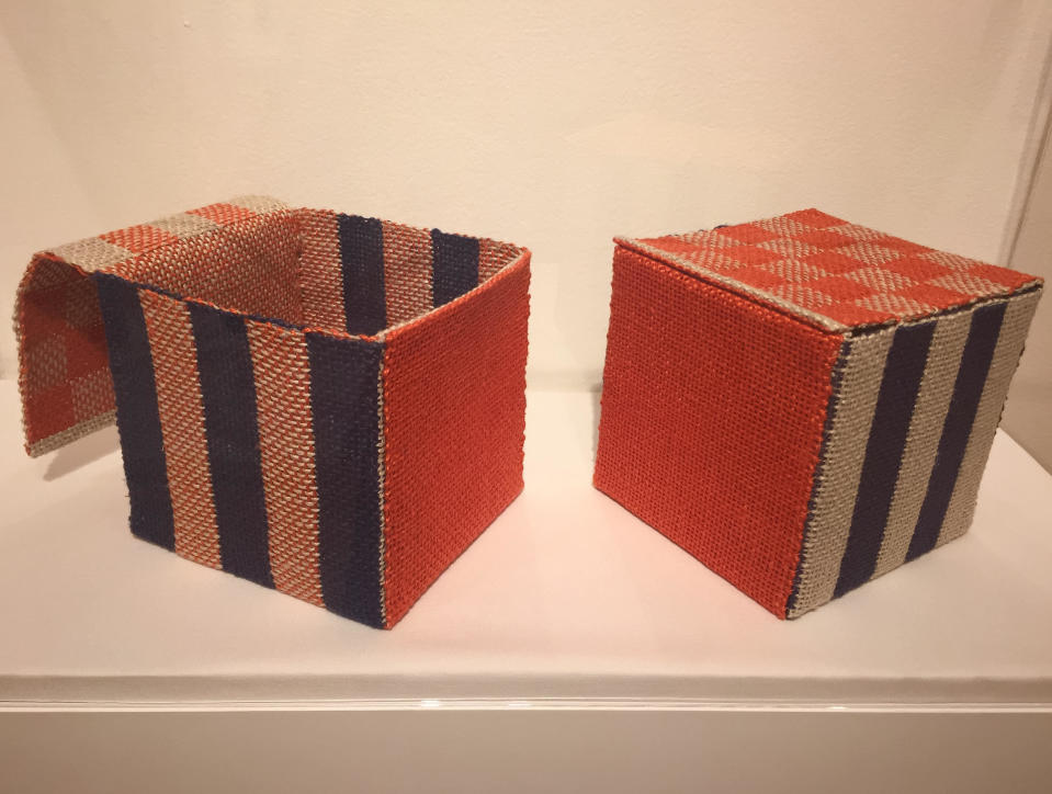 This photo taken on Dec. 2, 2016 shows circa 1990s woven "Paired Boxes" by Berkeley, Calif., based 90-year-old fiber artist and weaver Kay Sekimachi. The pieces are part of the "Kay Sekimachi: Simple Complexity" exhibit the Craft and Folk Art Museum in Los Angeles, chronicling Sekimachi's decades-long career. The exhibit opened on Sept. 25, 2016, and runs through Jan. 8, 2017. (Solvej Schou via AP)