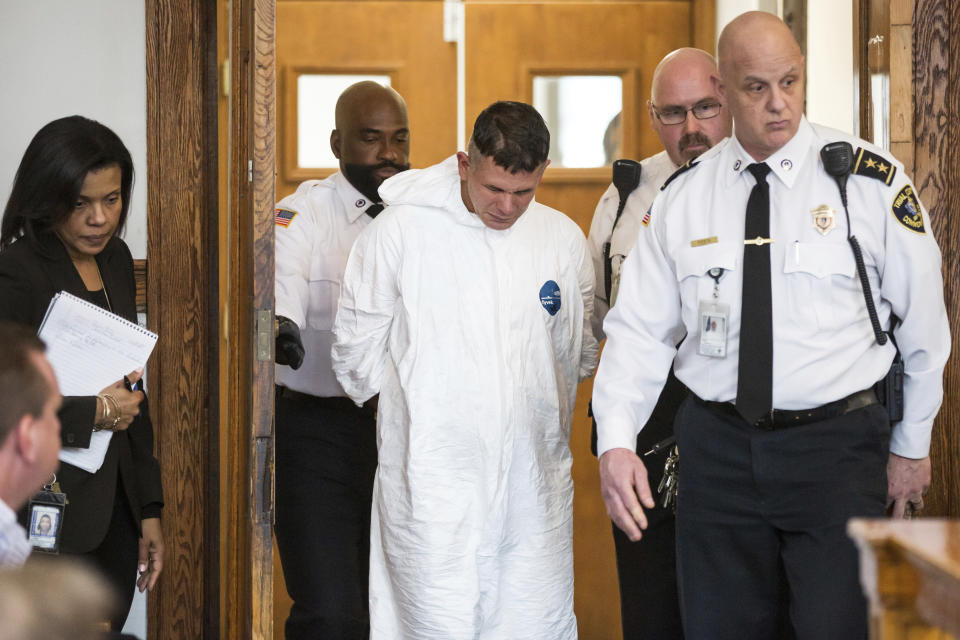 Victor Pena, center, appears at the Charlestown Division of the Boston Municipal Court in Charlestown, Mass., Wednesday, Jan. 23, 2019. Pena, who has been charged with kidnapping a 23-year-old woman in Boston has been ordered to undergo a mental health evaluation and will be held without bail. (Aram Boghosian/The Boston Globe via AP, Pool)