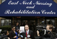 Howard Fensterman, center, representing the East Neck Nursing and Rehabilitation Center, defends the nursing home during a news conference, Tuesday, April 8, 2014, in West Babylon, N.Y. The nursing home hired a male exotic dancer to perform for its patients, according to a lawsuit filed by facility resident Bernice Youngblood in State Supreme Court in Suffolk County. (AP Photo/Mark Lennihan)