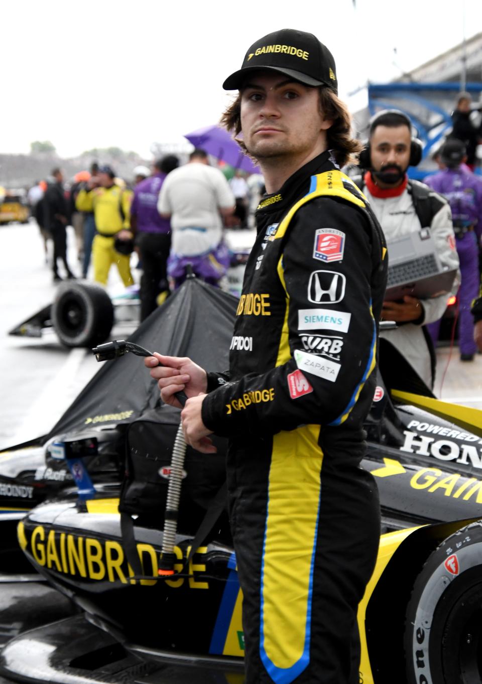 Andretti Autosport with Curb-Agajanian driver Colton Herta (26) stands by his car in pit lane Saturday, May 14, 2022, before the GMR Grand Prix at Indianapolis Motor Speedway. 