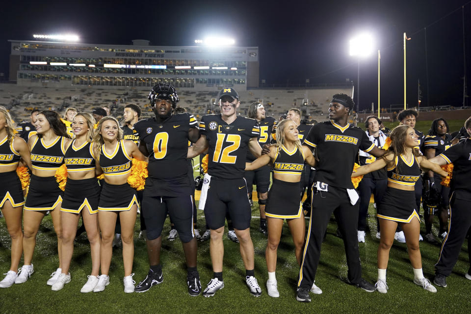 Missouri quarterback Brady Cook (12) and defensive lineman Jayden Jernigan (0) celebrate following a 52-24 victory over Louisiana Tech in an NCAA college football game Thursday, Sept. 1, 2022, in Columbia, Mo. (AP Photo/L.G. Patterson)