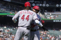 Cincinnati Reds' Christian Encarnacion-Strand, right, celebrates after hitting a two-run home run that scored Elly De La Cruz (44) during the eighth inning of a baseball game against the San Francisco Giants in San Francisco, Wednesday, Aug. 30, 2023. (AP Photo/Jeff Chiu)